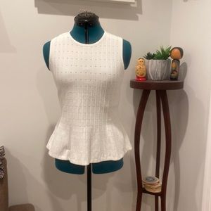 Sleeveless peplum sweater